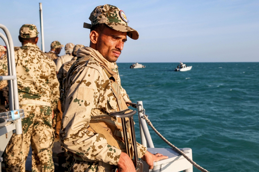 File photo of a Yemeni coastguard member loyal to the internationally-recognised government riding in a patrol boat in the Red Sea off of the government-held town of Mokha in the western Taiz province, close to the strategic Bab al-Mandab Strait, on December 12, 2023. — AFP pic