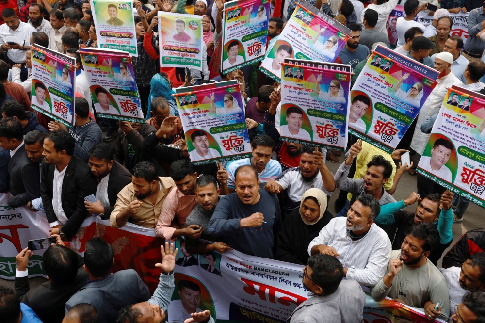 Members of the Bangladesh Nationalist Party (BNP) join in a human-chain protest to mark the International Human Rights Day, demanding the release of BNP activists who were arrested, ahead of the twelfth national election, in front of the National Press Club in Dhaka, Bangladesh, December 10, 2023. — Reuters pic