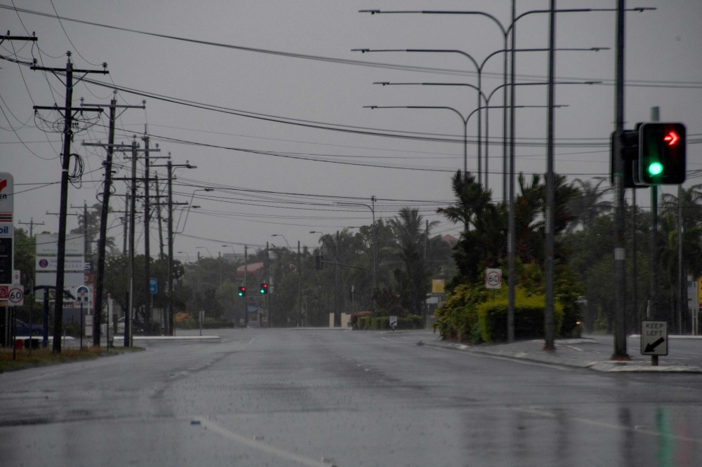 Empty roads are seen as Cyclone Jasper approaches landfall near Cairns in far north Queensland on December 13, 2023. — AFP pic