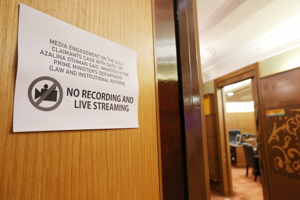 A sign that forbids recording and live streaming notice at the entrance for Datuk Seri Azalina Othman Said’s media engagement on the Sulu claimants case, April 11, 2023. — Picture by Choo Choy May