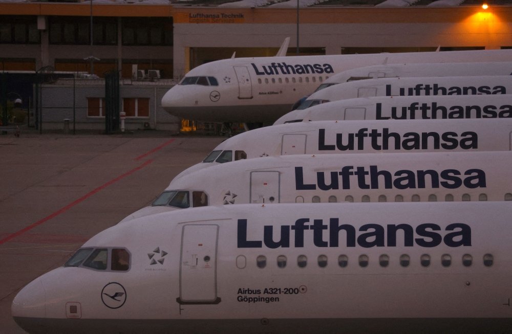 Planes of German air carrier Lufthansa are parked as Lufthansa pilots start a strike over a wage dispute, at the airport in Frankfurt September 2, 2022. Lufthansa and its subsidiaries demanded €740,000 (RM3.7 million) in compensation from climate activists for cancellations, delays and changes in flight routes due to their protests at German airports. — Reuters pic