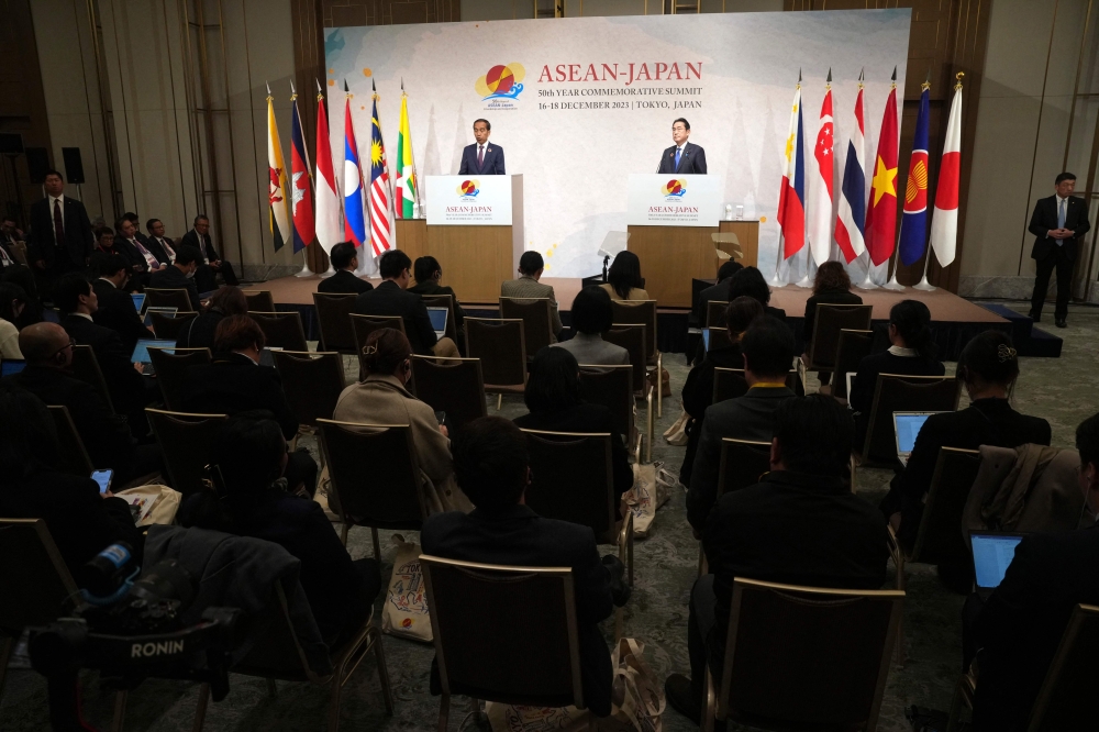 Indonesia's President Joko Widodo (left) and Japan's Prime Minister Fumio Kishida attend their Joint Chairpersons' Press Announcement after the Asean-Japan Commemorative Summit Meeting in Tokyo December 17, 2023. — Eugene Hoshiko/Pool/AFP pic 
