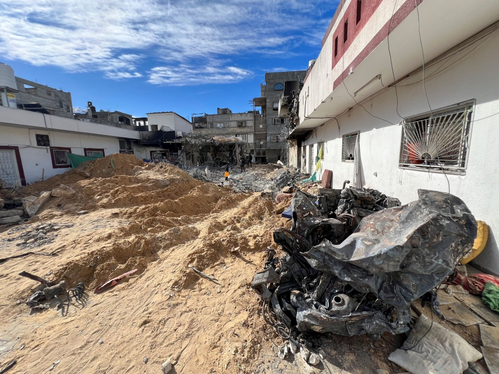 Rubble lies next to a building following an Israeli raid at Kamal Adwan hospital, amid the ongoing conflict between Israel and Palestinian Islamist group Hamas, in the northern Gaza Strip December 16, 2023. — Reuters pic  