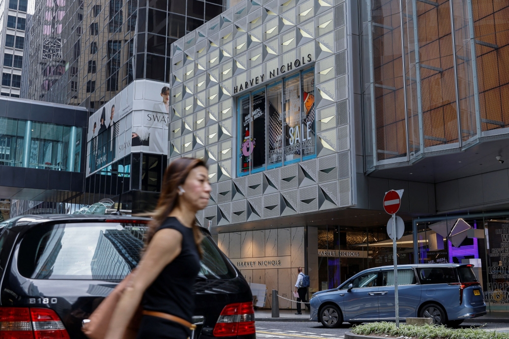 A woman walks outside a Harvey Nichols store, a London-headquartered multi-brand luxury retailer, in Hong Kong November 30, 2023. — Reuters pic  