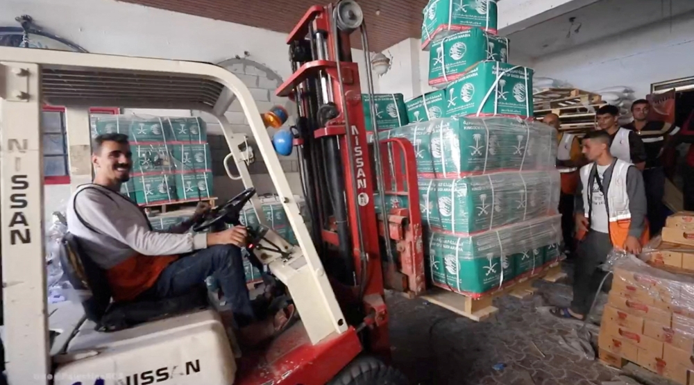 Palestinian Red Crescent workers transport aid, amid the ongoing conflict between Israel and the Palestinian Islamist group Hamas, in Khan Younis, Gaza in this still image taken from a video obtained from social media, released on December 14, 2023. — Palestine Red Crescent Society pic via Reuters