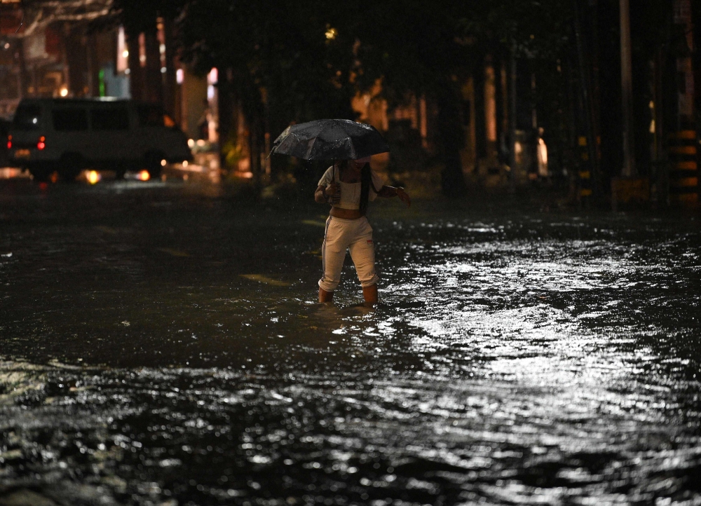 A man went missing and thousands of people in the Philippines were sheltering in evacuation centres today as Tropical Storm Jelawat hit the large southern island of Mindanao, causing scattered flooding and power cuts. — AFP pic