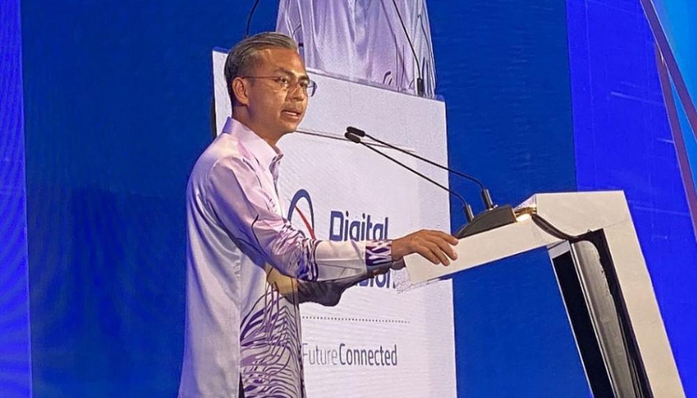 Communications Minister Fahmi Fadzil has doubled down on calls to telcos to waive extra fees for 5G access. — SoyaCincau pic