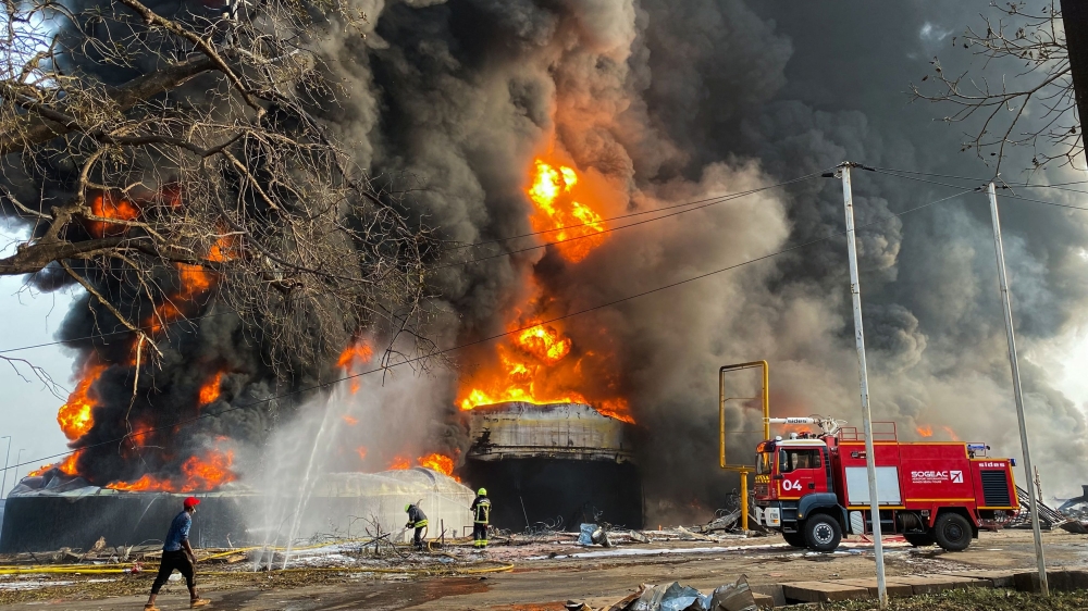Firemen work to extinguish fire after a blast at an oil terminal in Conakry, Guinea December 18, 2023. ― Reuters pic