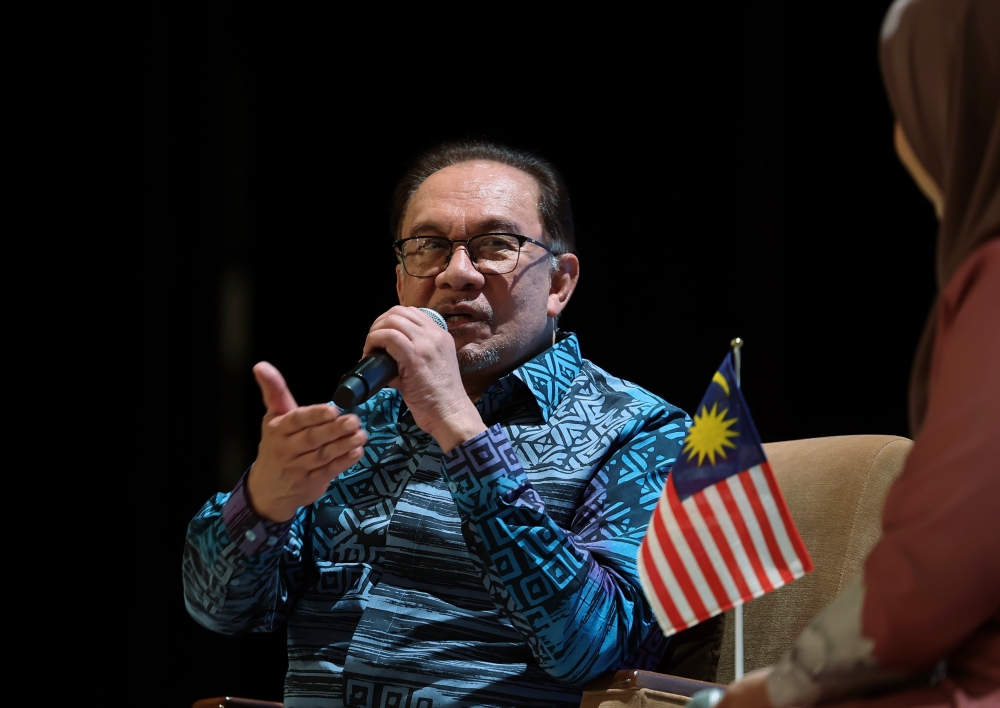 Prime Minister Datuk Seri Anwar Ibrahim speaks during an interactive session with Malaysians at the Meet and Greet with the Malaysian Diaspora in Japan, in Tokyo December 18, 2023. — Bernama pic