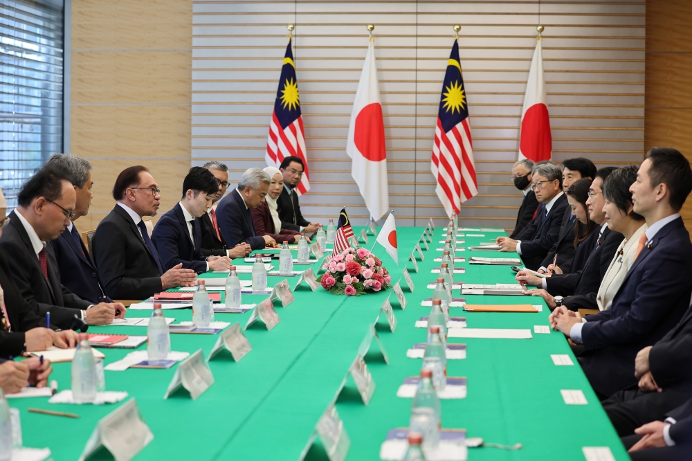 Prime Minister Datuk Seri Anwar Ibrahim during a bilateral meeting with his Japanese counterpart Fumio Kishida at the latter’s office in Tokyo December 16, 2023. Anwar is accompanied by Foreign Minister Datuk Seri Mohamad Hasan and Minister of Investment, Trade and Industry Datuk Seri Tengku Zafrul Tengku Abdul Aziz. — Bernama pic