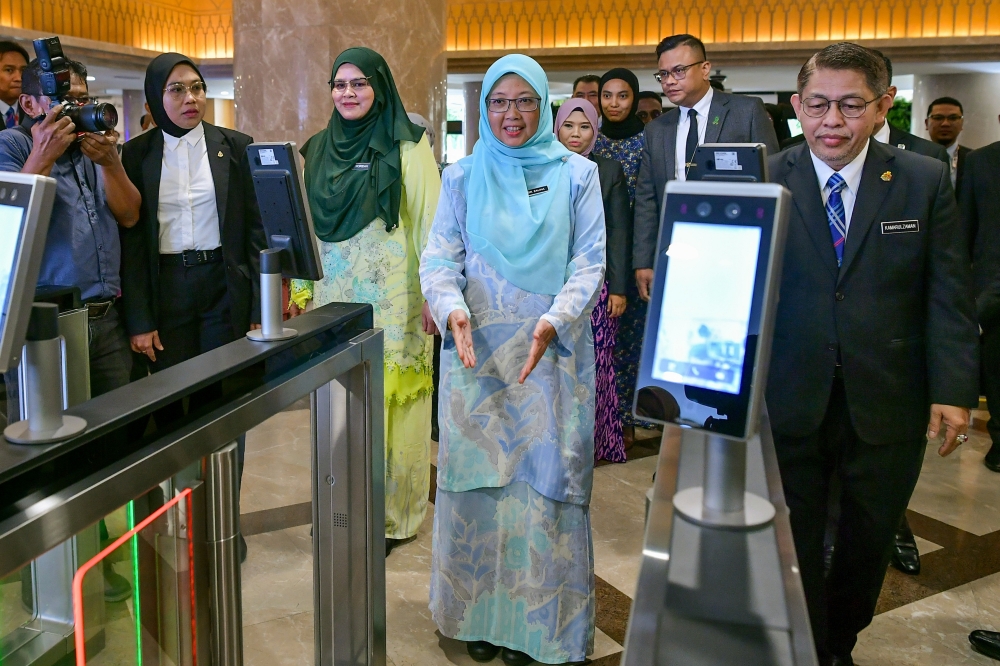 Minister in the Prime Minister’s Department (Federal Territory) Dr Zaliha Mustafa (centre) arrives at the Kuala Lumpur City Hall at Menara DBKL 1 in Kuala Lumpur December 19, 2023. — Bernama pic