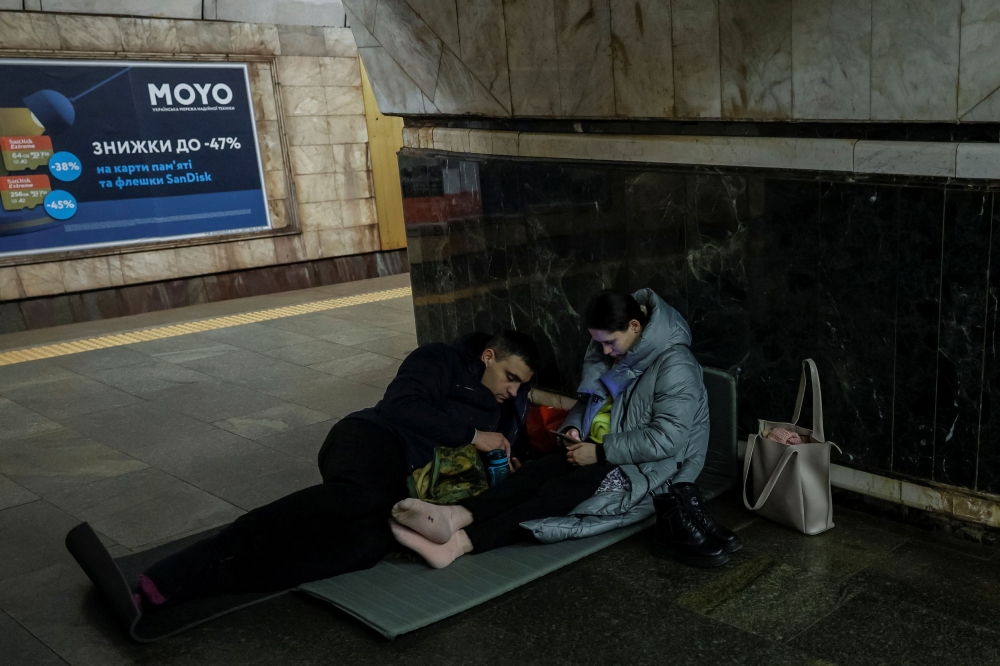 People take cover inside a subway station during an air raid alert at night, amid Russia's attack on Ukraine, in Kyiv, Ukraine December 19, 2023. ― Reuters pic