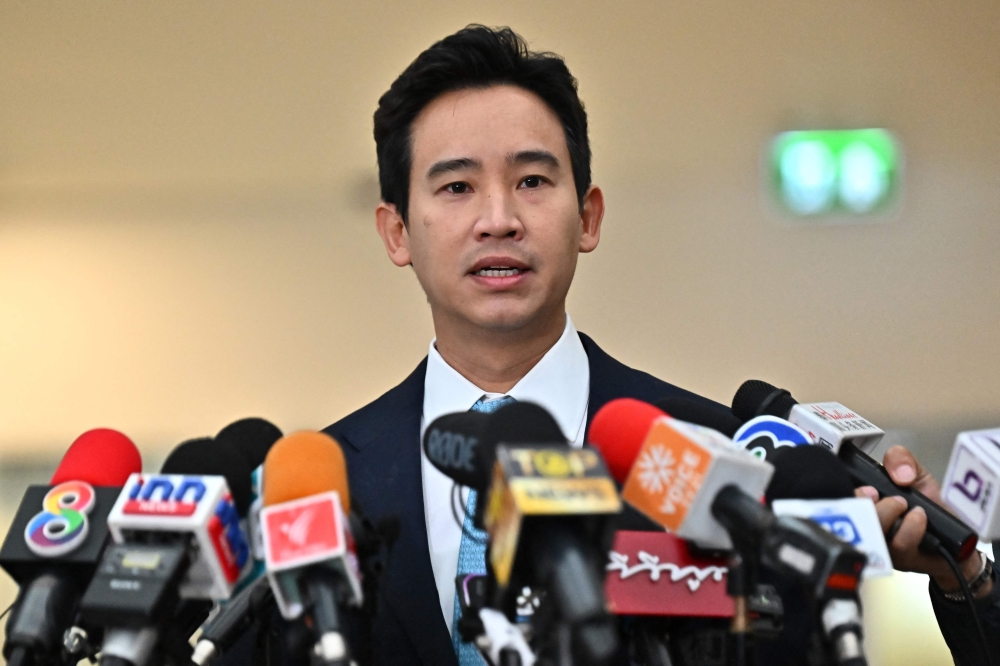 Former Thai prime ministerial candidate and ex-Move Forward Party leader Pita Limjaroenrat speaks to the media before a hearing regarding his ownership of media shares at the Constitutional Court in Bangkok on December 20, 2023. ― AFP pic