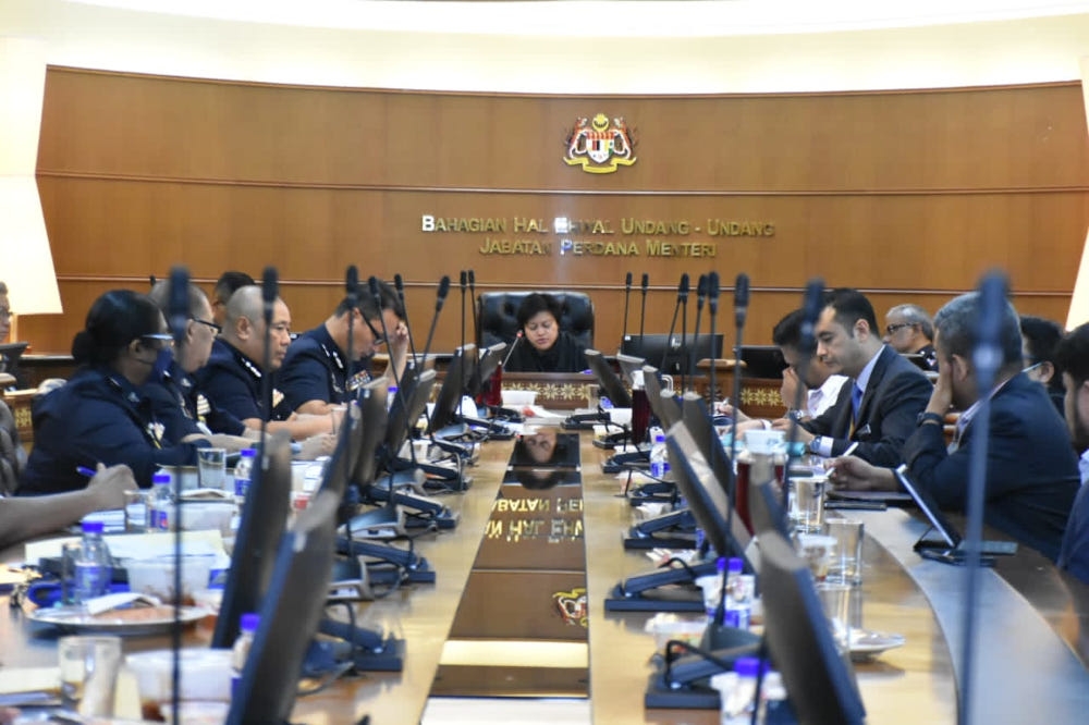 Minister in the Prime Minister’s Department (Law and Institutional Reform) Datuk Seri Azalina Othman Said chairs a meeting involving BHEUU, NFCC, Attorney General’s Chambers (AGC), Royal Malaysia Police (PDRM), National Security Council (NSC), Bank Negara Malaysia (BNM) and Malaysian Communications and Multimedia Commission (MCMC), December 20, 2023. — Picture from Facebook/Azalina Othman Said 