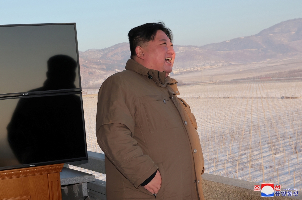 North Korean leader Kim Jong-un reacts as he views the launch of a Hwasong-18 intercontinental ballistic missile during what North Korea says is a drill at an unknown location, December 18, 2023 in this picture released by the Korean Central News Agency. ― KCNA via Reuters