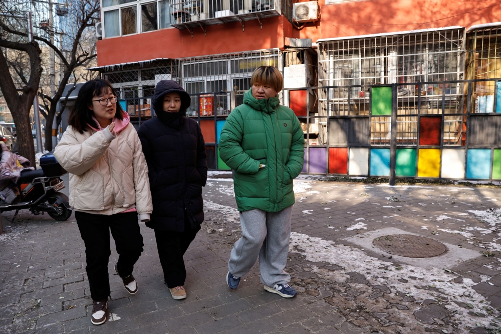 People walk on a street on a cold winter day in Beijing, China December 18, 2023. ― Reuters pic