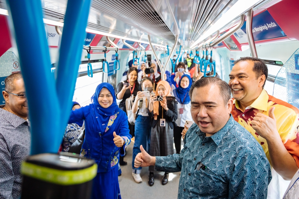 Transport Minister Anthony Loke with Deputy Minister of Women, Family and Community Development Datuk Seri Noraini Ahmad ride on an MRT train during the launch ceremony of Kajang Line Mass Rapid Transit (MRT) Women’s Coach pilot project, in Kuala Lumpur December 21, 2023. — Picture by Firdaus Latif