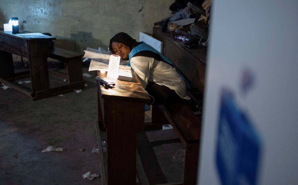 An Independent National Electoral Commission (CENI) official sleeps at a polling centre following the Presidential election in Goma, North Kivu province of the Democratic Republic of Congo December 20, 2023. — Reuters pic