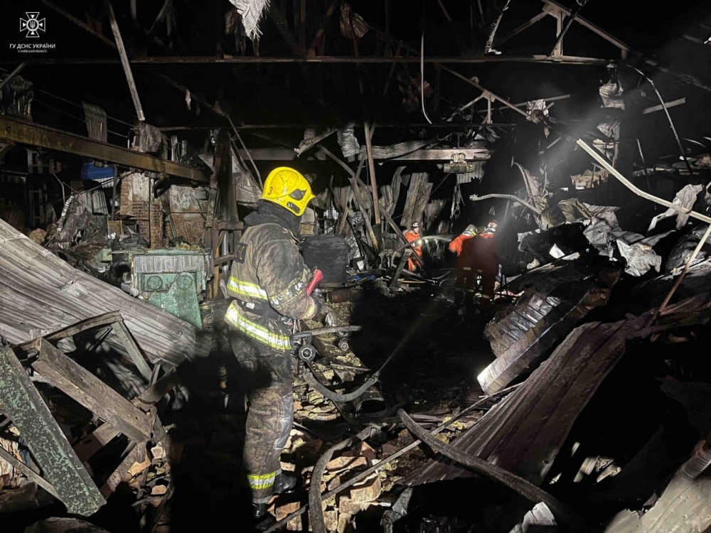 Firefighters work at a site of a warehouse heavily damaged during a Russian drone strike, amid Russia's attack on Ukraine, in Kyiv region, Ukraine, released December 21, 2023. ― Press service of the State Emergency Service of Ukraine in Kyiv region/Handout via Reuters