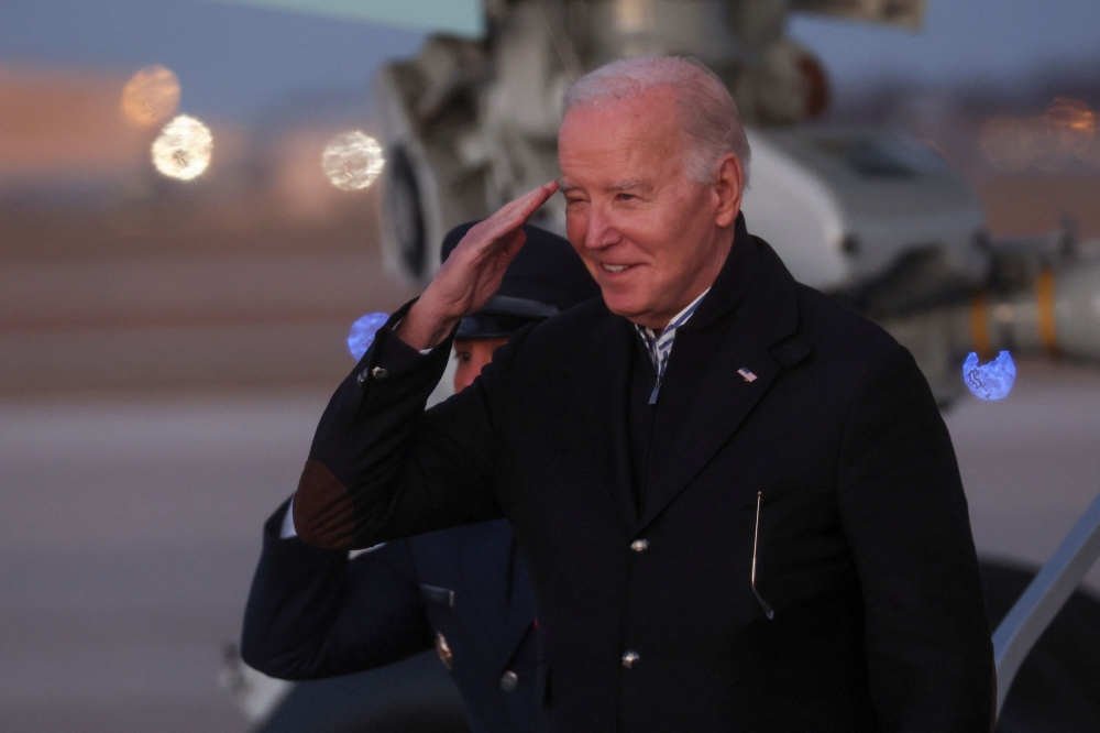 US President Joe Biden gestures after disembarking Air Force One following his travel to Milwaukee, at Joint Base Andrews, Maryland December 20, 2023. ― Reuters pic