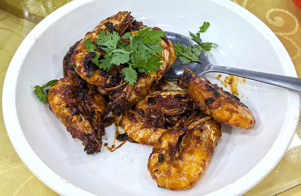 Dry Fried Prawns here are slightly different from the usual soy sauce and scallion base, using chilli and black beans instead.