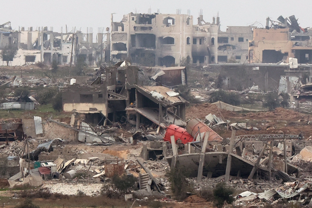 A picture taken from southern Israel near the border with the Gaza Strip on December 21, 2023, shows destruction in northern Gaza resulting from weeks of Israeli bombardment of the Palestinian territory. ― AFP pic