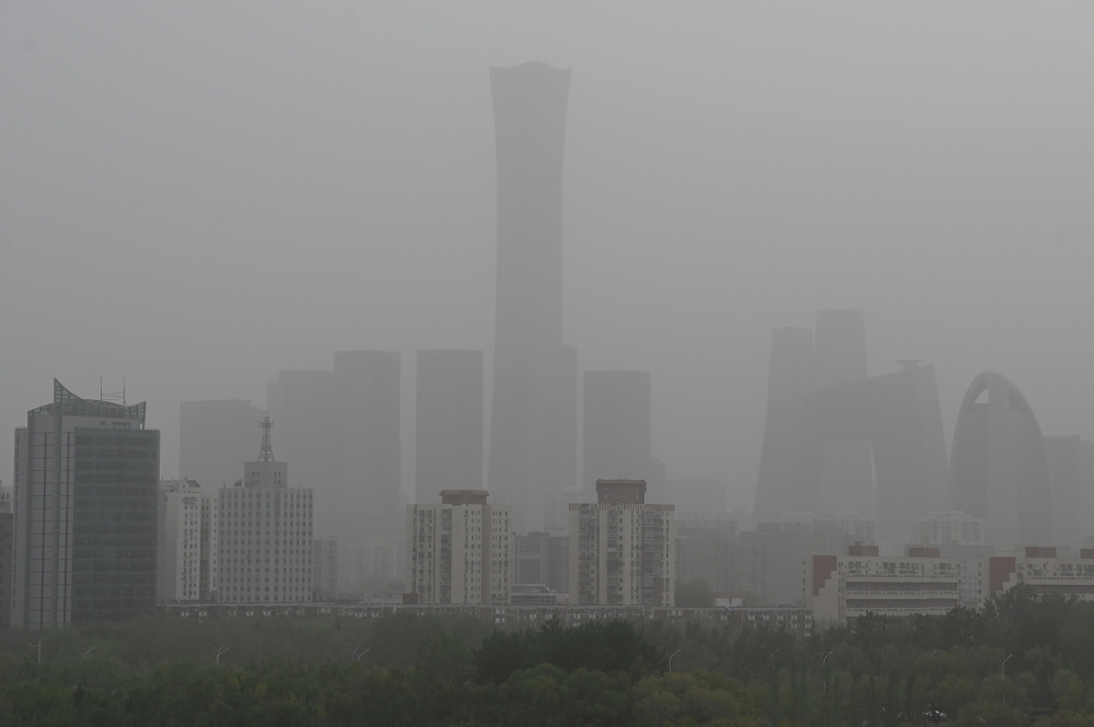 High rise buildings at central business district are seen on a severely polluted day in Beijing April 12, 2023. China's air pollution worsened in 2023, the first time it has done so in a decade, a study released today said. — AFP pic