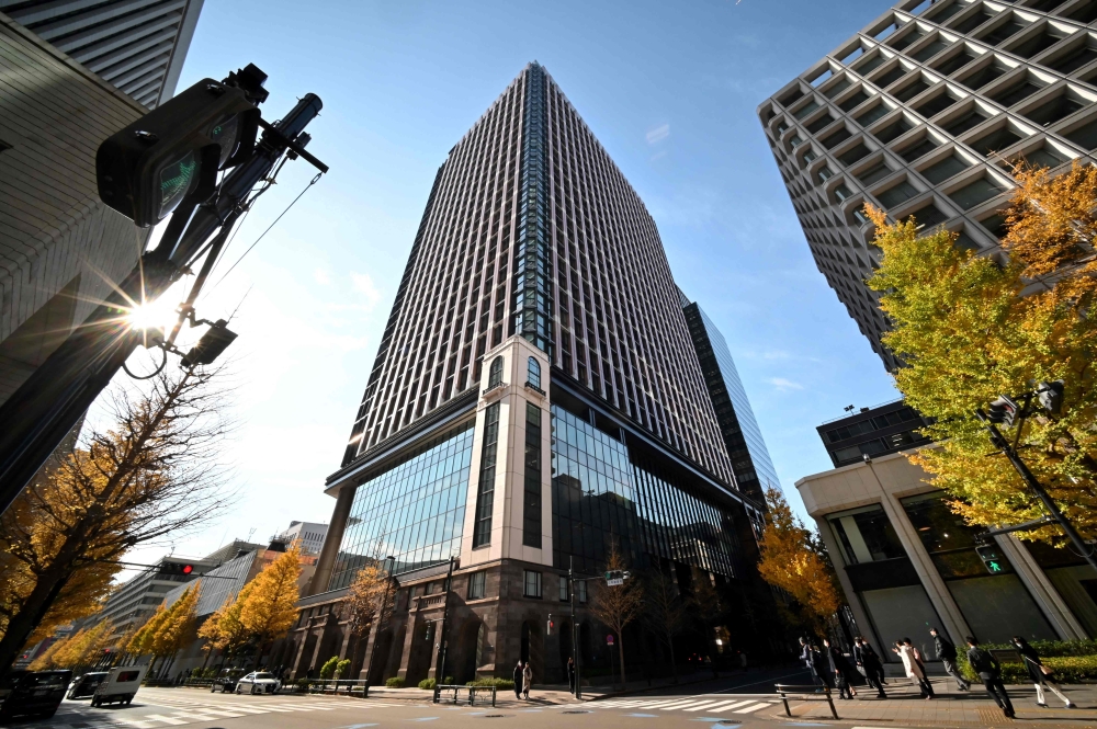 This picture shows an office building (centre) where Nippon Steel's head office is located in Tokyo December 19, 2023. — AFP pic