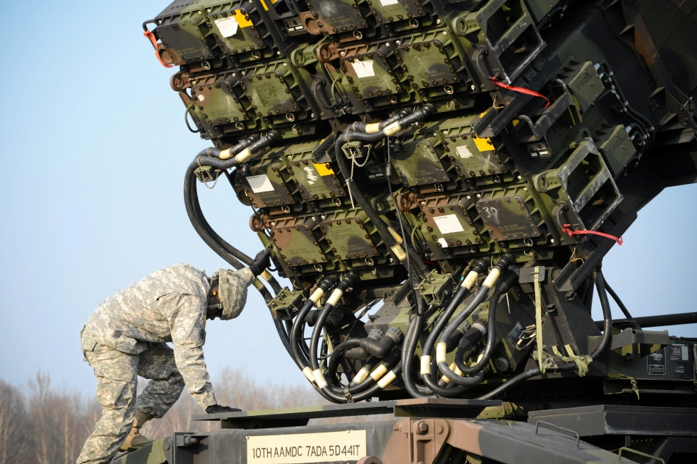 A US soldier inspects a Patriot missile defense battery during join exercises at military grounds in Sochaczew, near Warsaw March 21, 2015. — Franciszek Mazur/Agencja Gazeta/Reuters pic 