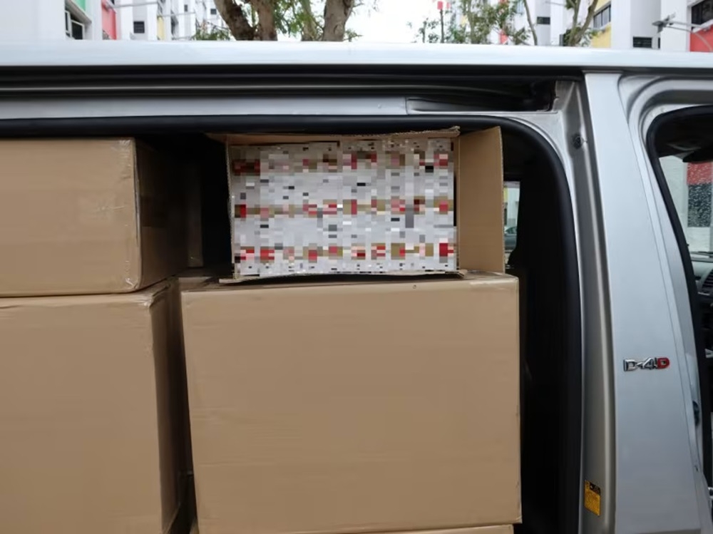 Duty-unpaid cigarettes found in a van at a car park in Yishun. ― Picture courtesy of Singapore Customs