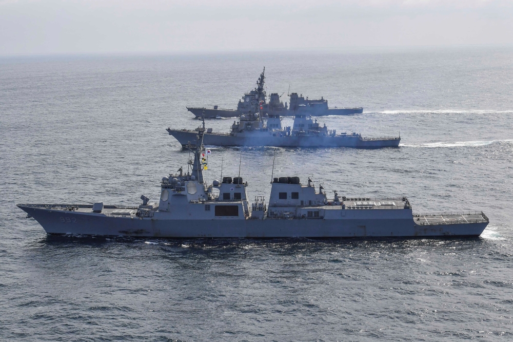 File photo of South Korean Navy’s destroyer Yulgok Yi I, the US Navy’s destroyer USS Benfold and Japan Maritime Self-Defence Force’s destroyer Atago take part in joint naval missile defence exercises in international waters between Korea and Japan. — Reuters pic