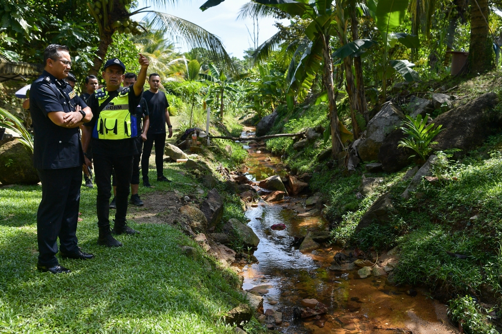 File picture shows police patrolling the area where the body of six-year-old autistic boy Zayn Rayyan Abdul Matiin was found, December 8, 2023. — Bernama pic