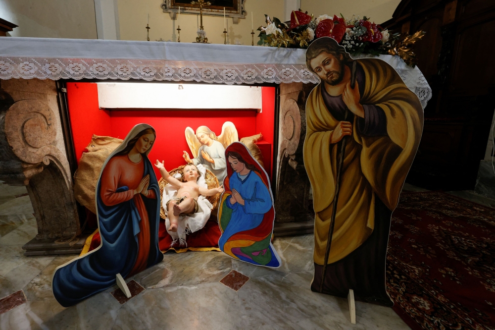 A nativity scene featuring two mothers of the Baby Jesus, instead of the conventional Mary and Joseph figurines, goes on display in the Church of Saints Peter and Paul in Capocastello di Mercogliano, Italy December 23, 2023. ― Reuters pic