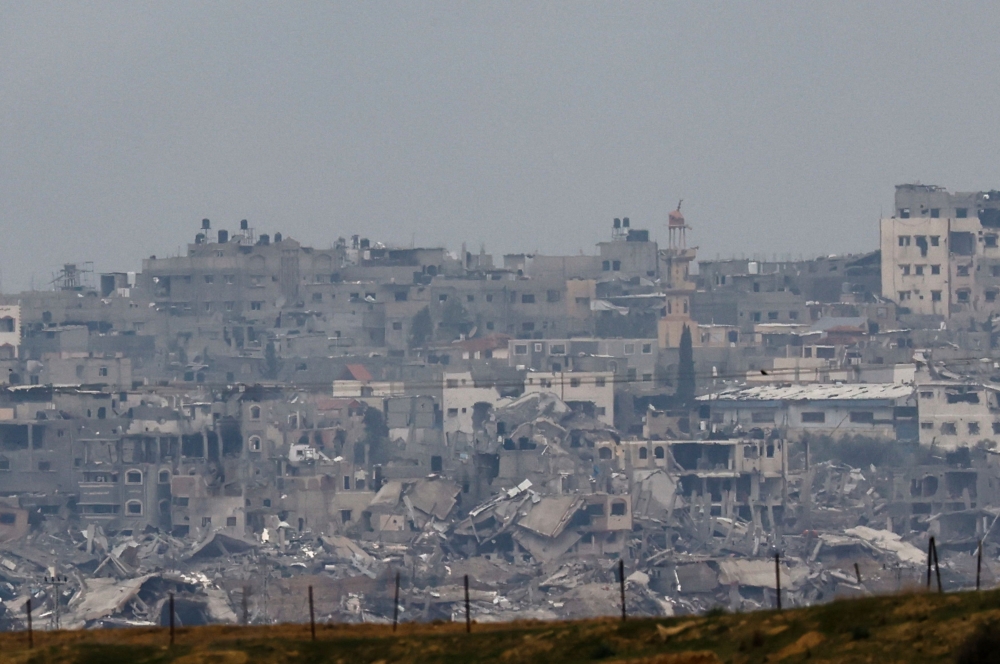 Destroyed buildings lay in ruin in the Gaza Strip, amid the ongoing conflict between Israel and the Palestinian Islamist group Hamas, as seen from southern Israel, December 21, 2023. ― Reuters pic