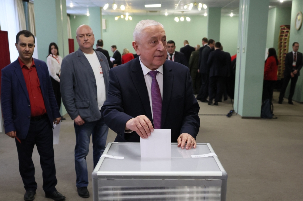 Nikolai Kharitonov, member of the Russian State parliament Duma, casts his ballot as he votes for a presidential candidate during the Russian Communist Party’s congress ahead of next year’s presidential election in the village of Rozhdestveno, Moscow region, on December 23, 2023. ― AFP pic