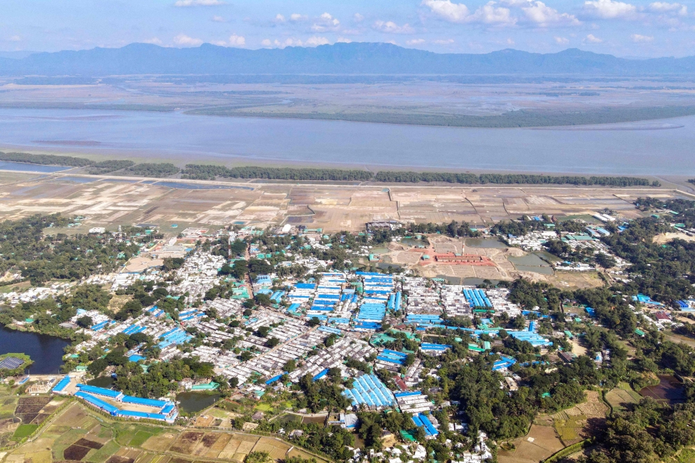 This aerial photograph taken on November 24, 2023 shows a view of the Nayapara Rohingya refugee camp, along the Naf river at Teknaf in Bangladesh’s southeastern district of Cox’s Bazar. Rohingya refugees had hoped for a safe space at camps in Bangladesh after fleeing brutal violence in Myanmar but many of the persecuted ethnic minority are risking another dangerous sea crossing to escape hunger, kidnapping and gang violence. — AFP pic