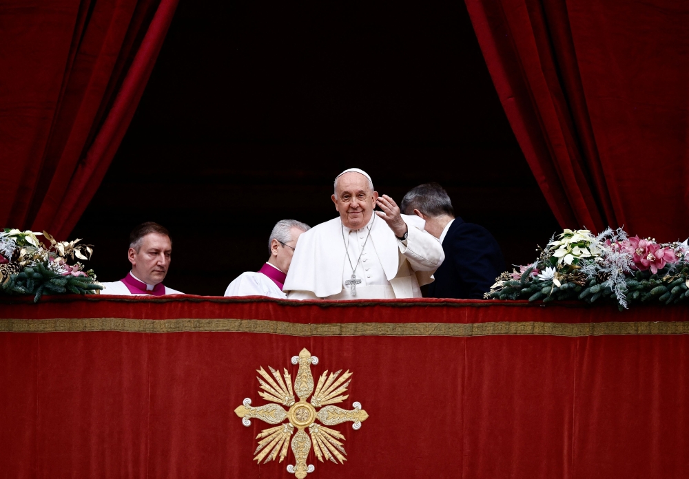 Pope Francis delivers his traditional Christmas Day Urbi et Orbi message to the city and the world from the main balcony of St. Peter's Basilica at the Vatican, December 25, 2023. — Reuters pic