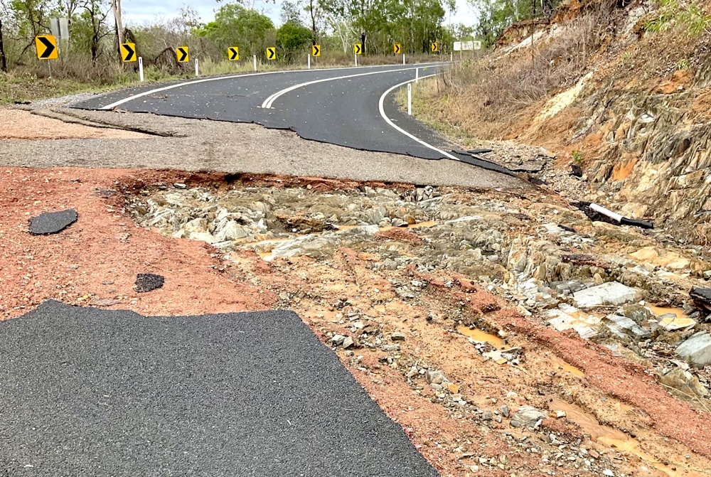A frame grab from a handout video footage by the Queensland Police Service showing a damaged part of the Mulligan Highway near the northern Australian town of Cooktown, after heavy rainfall caused major flash flooding. AFP pic/Queensland Police Service. — AFP pic 