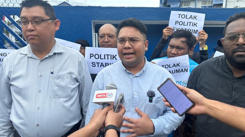 Federal Territory PKR Youth chief Mohammad Azfar Aza Azhar speaks to the reporters after lodging a police report against Federal Territory PAS, Dec 26, 2023. — Picture courtesy of Federal Territory PKR Youth