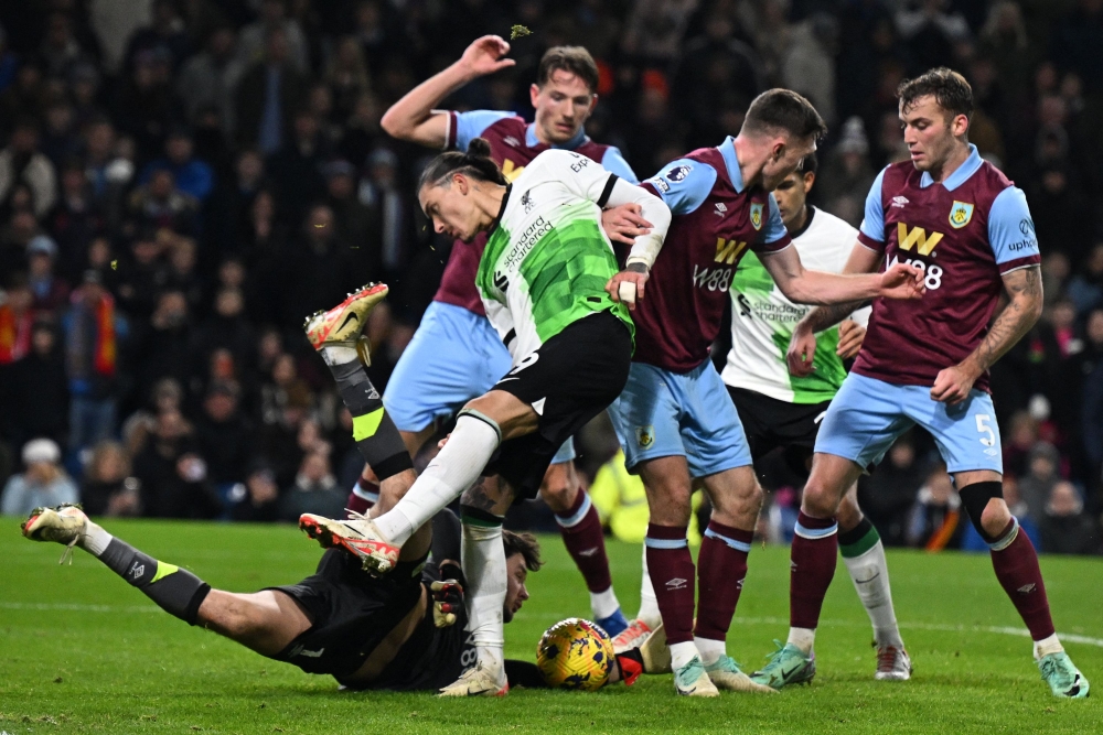 Burnley's English goalkeeper #01 James Trafford makes a save at the feet of Liverpool's Uruguayan striker Darwin Nunez during the English Premier League football match between Burnley and Liverpool at Turf Moor in Burnley, north-west England on December 26, 2023. — AFP pic