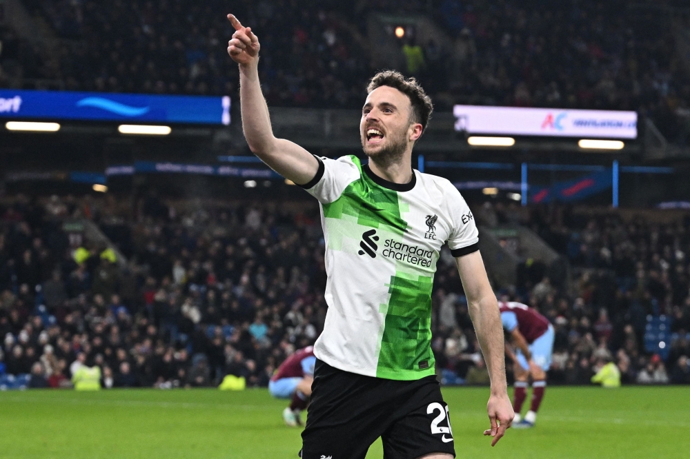 Liverpool's Portuguese striker #20 Diogo Jota celebrates after scoring their second goal during the English Premier League football match between Burnley and Liverpool at Turf Moor in Burnley, north-west England on December 26, 2023. — AFP pic