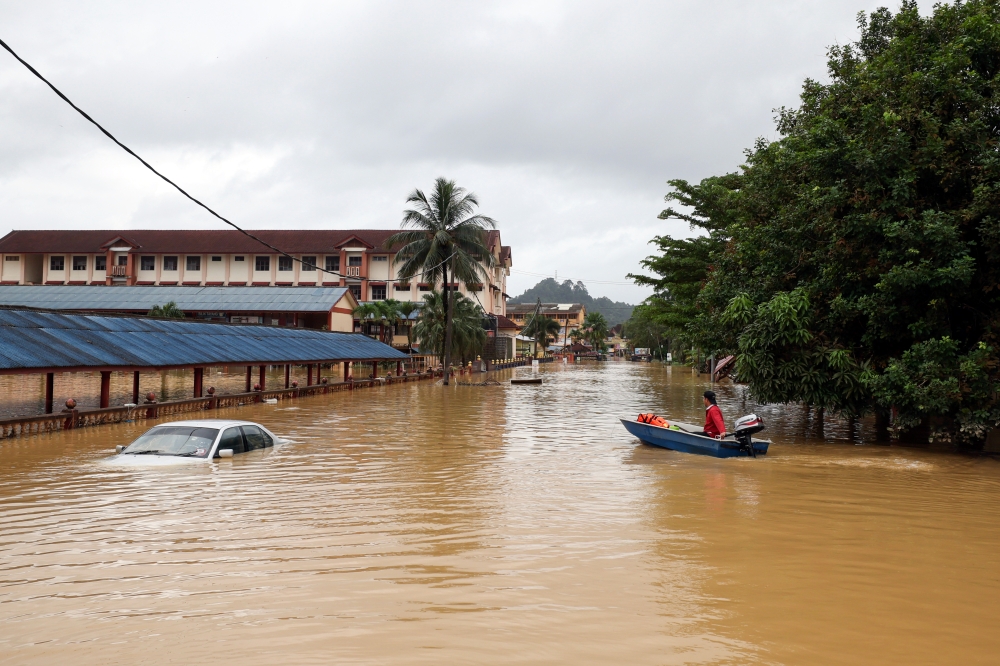 A car is submerged in floodwater due to heavy rain in Kuala Berang, Terengganu, December 27, 2023. — Bernama pic 