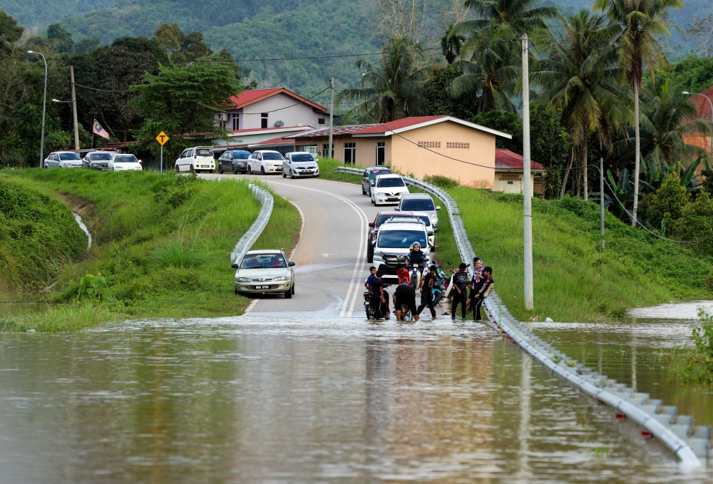 The main land route linking some 400 residents of Kampung Pemberian in Kuala Krai to the town centre has been severed since Monday, December 27, 2023. — Bernama pic 
