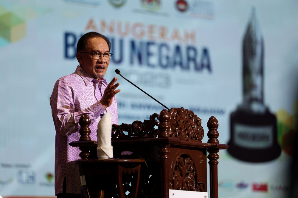 Prime Minister Datuk Seri Anwar Ibrahim delivers a speech during the launch of the 2023 National Book Award at Universiti Pendidikan Sultan Idris, in Tanjung Malim December 21, 2023. — Bernama pic