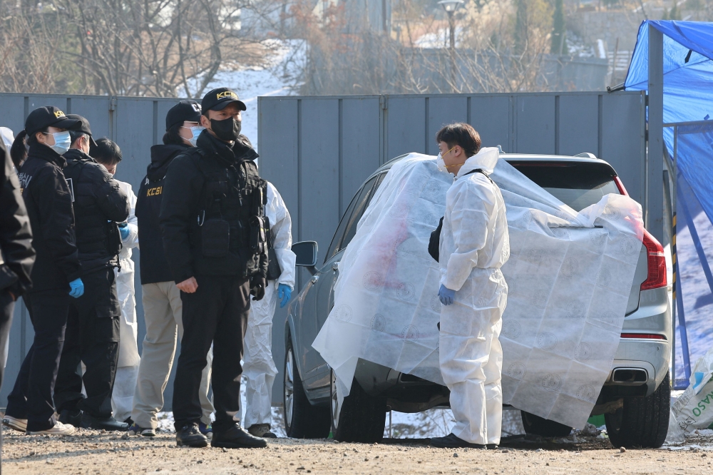 Police officers examine a scene where South Korean actor Lee Sun-kyun was found dead at a park in Seoul, South Korea, December 27, 2023. — Yonhap via Reuters pic