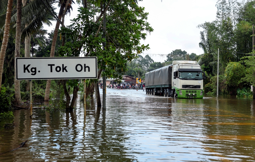 A road in Kampung Tok Oh, Tumpat, is inundated with floodwater, December 28, 2023. — Bernama pic 