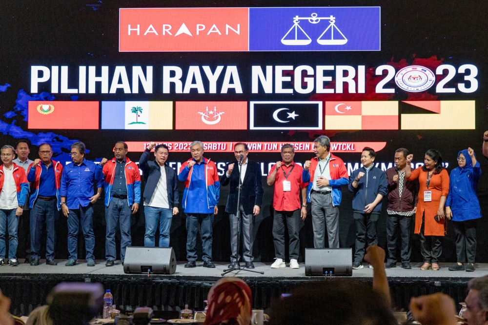 Prime Minister and Pakatan Harapan chairman Datuk Seri Anwar Ibrahim with other leaders of his coalition during the unity government secretariat results viewing at World Trade Centre in Kuala Lumpur August 12, 2023. — Picture by Firdaus Latif