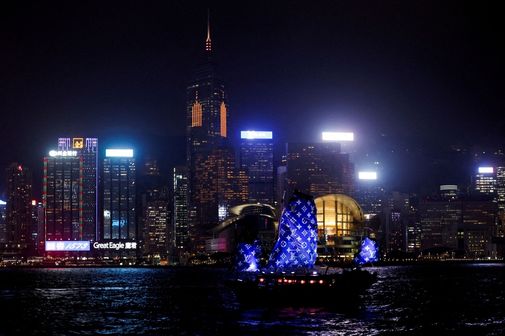 File photo of a ship sailing with a city view in the background in Hong Kong, China November 30, 2023. — Reuters pic