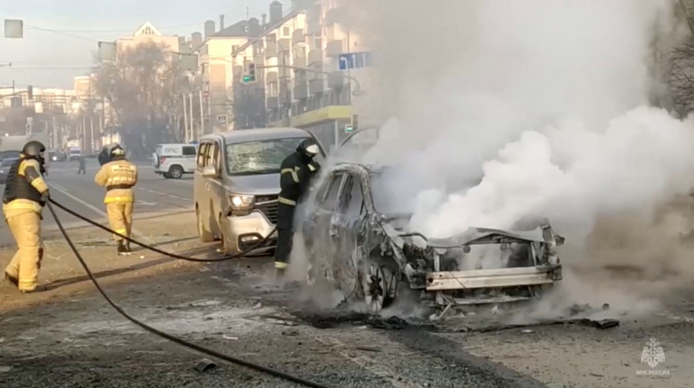 Firefighters extinguish a burning car following what was said to be Ukrainian forces' shelling in the course of Russia-Ukraine conflict, in Belgorod, Russia December 30, in this still image taken from video. — Reuters pic