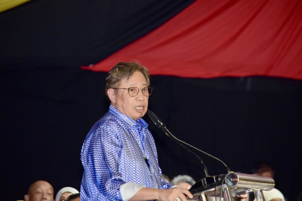 Abang Johari speaking at the official state New Year countdown event at Kuching Waterfront last night. — Picture by Roystein Emmor